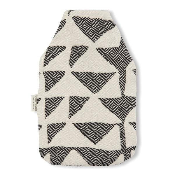 soft merino wool hot water bottle by British Maker Beatrice Larkin, black and white abstract pattern.