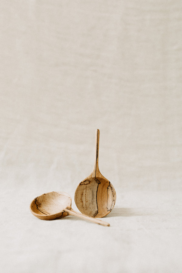 Small hand carved multi purpose scoop made from sustainably sourced wood. shallow scoop and a delicate long handle.