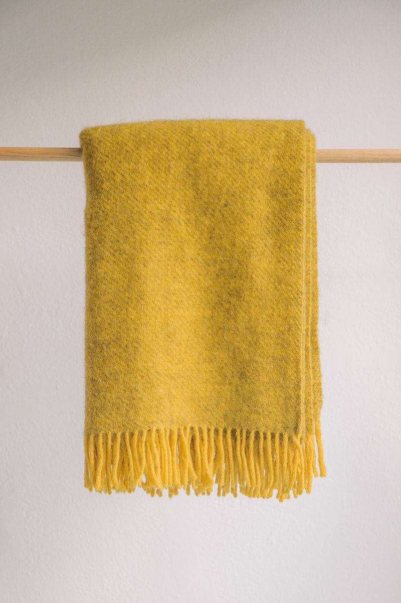 Gorse colour lambswool and recycled wool blanket with tassel detail