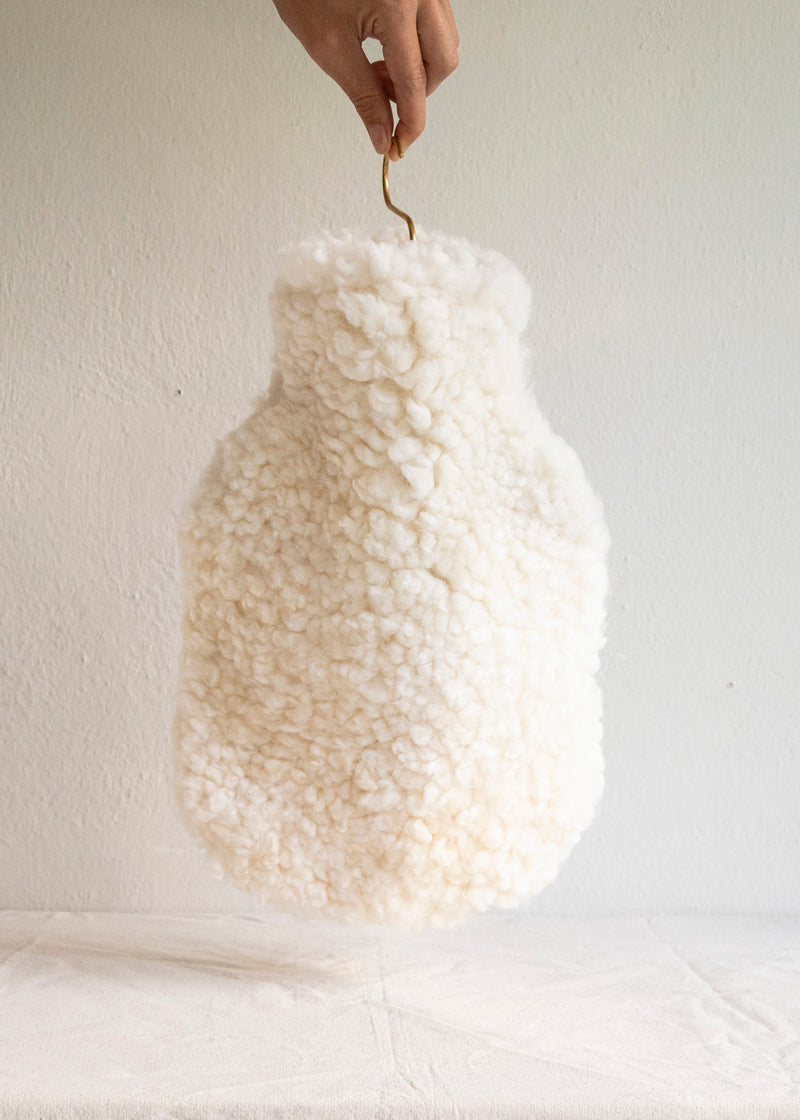 Hot water bottle made from sheepskin and cream colour